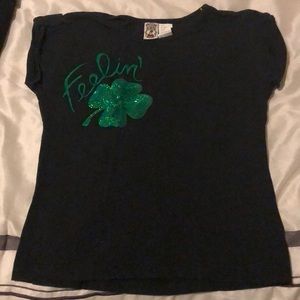 Black tee shirt with green sequins.